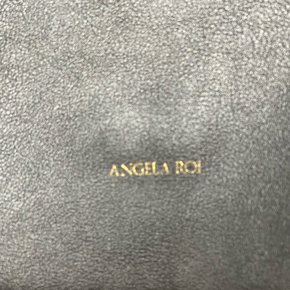 Angela Roi’s vegan midi size black handbag.